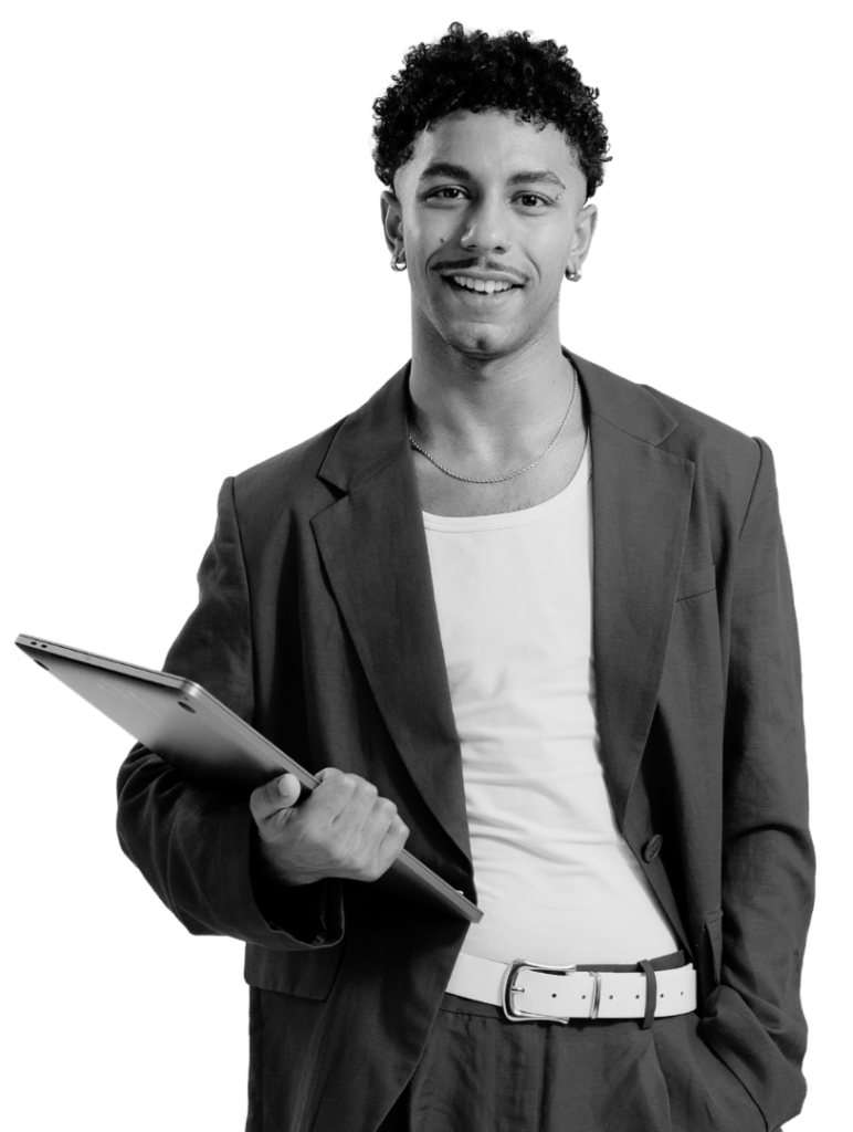 a person with a laptop in his hand smiling